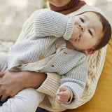 BABIES' MOSS STITCH CARDIGAN